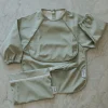 Kids Micasso Long-sleeved Bib with integrated pocket 6-24m - Sage